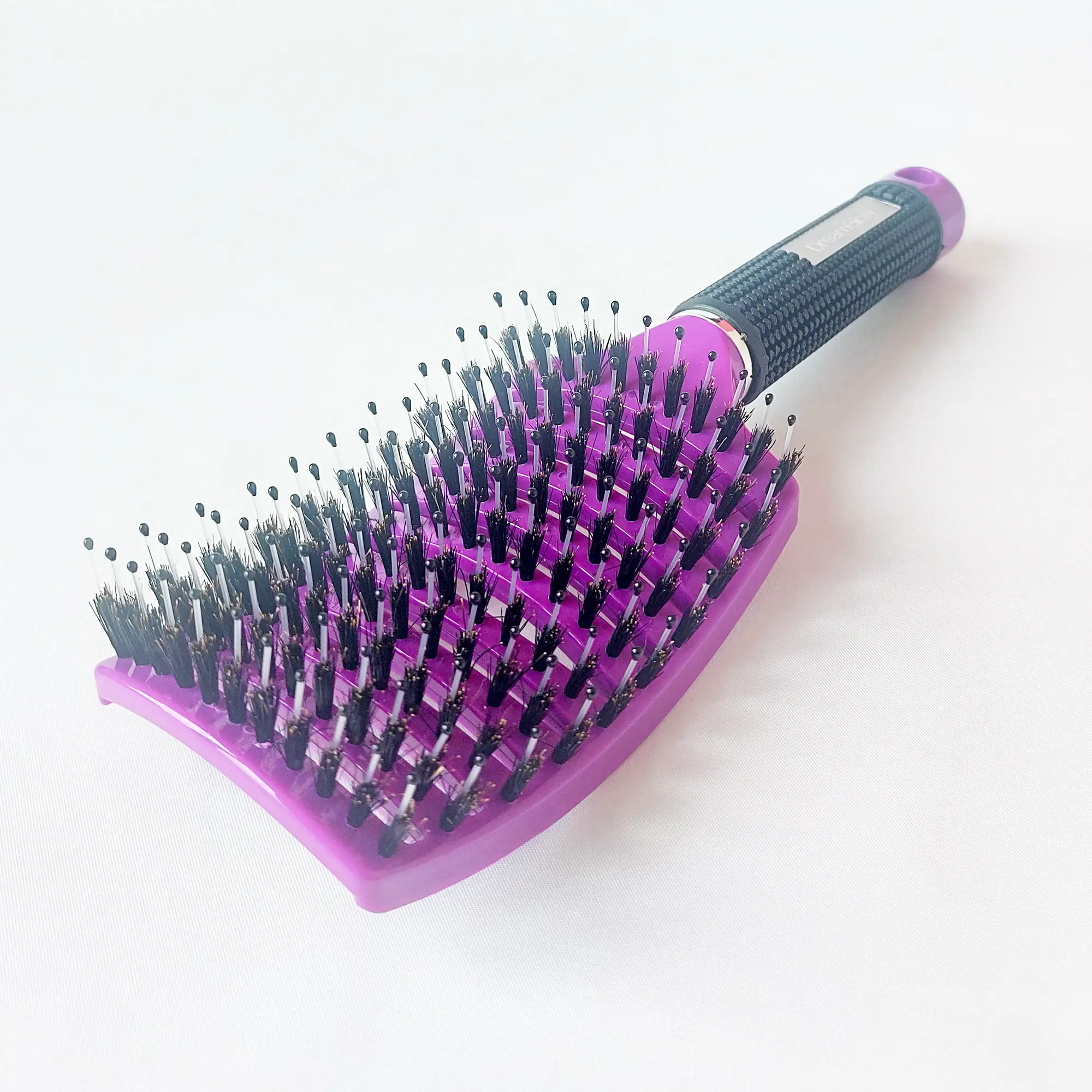 DreamGlow Anti-klit Haarborstel in paars op neutrale achtergrond