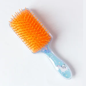 DreamGlow Magische Kinderborstel in blauw oranje op neutrale achtergrond
